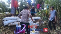 Kapolsek Belawa Imbau Warga Waspada Banjir, Polisi Turun Kerja Bakti Antisipasi Tanggul Jebol